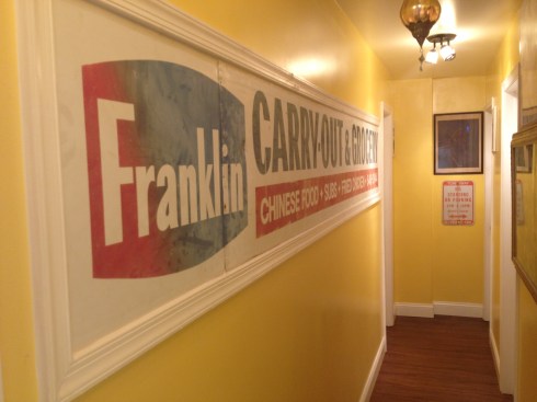 Franklin Carryout Sign Preserved on the Wall at Indigo