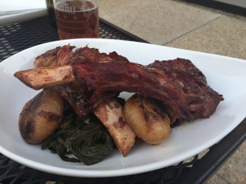 Bedrock Ribs with Greens and Glazed Onions at Driftwood Kitchen